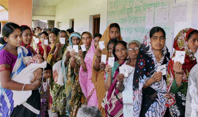 People standing in queue to cast vote