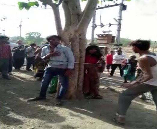 A man and his two relatives including a minor were tied to a tree and beaten up in Arjun Colony