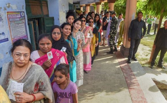 People Standing in queue to cast their vote