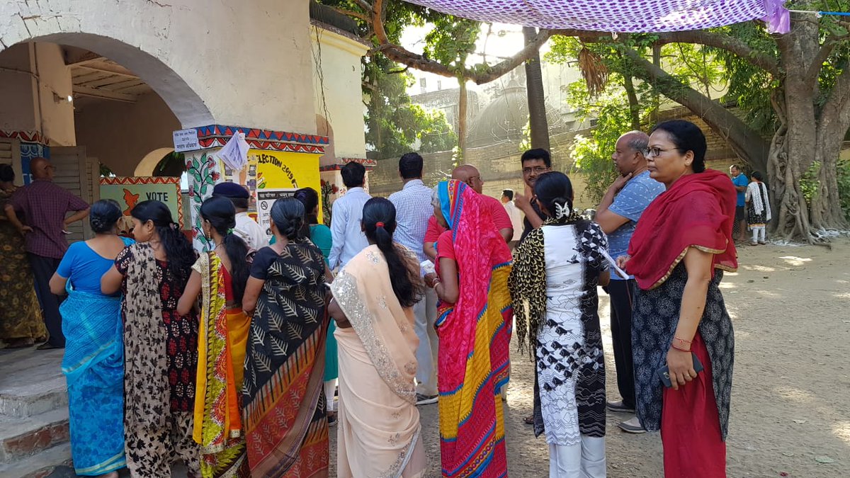 People Standing in queue to cast their vote