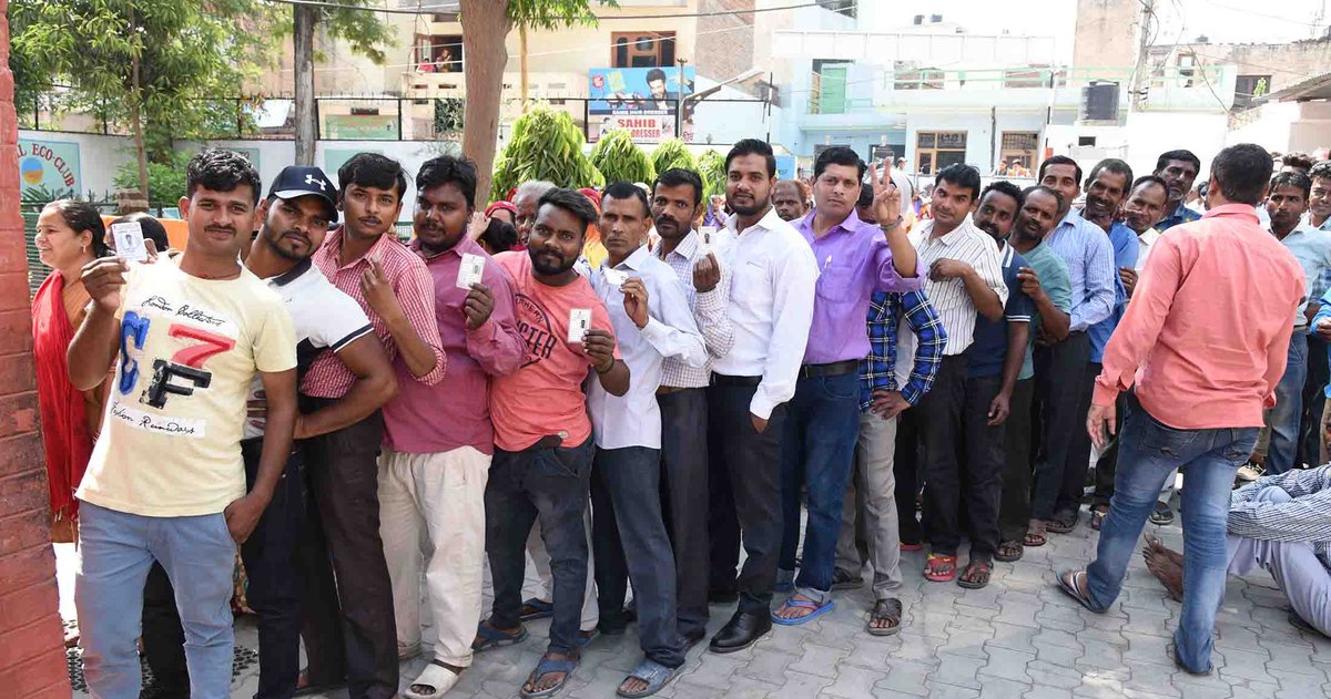 People standing in queue to cast vote