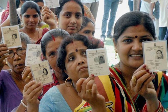 People standing in queue to cast vote