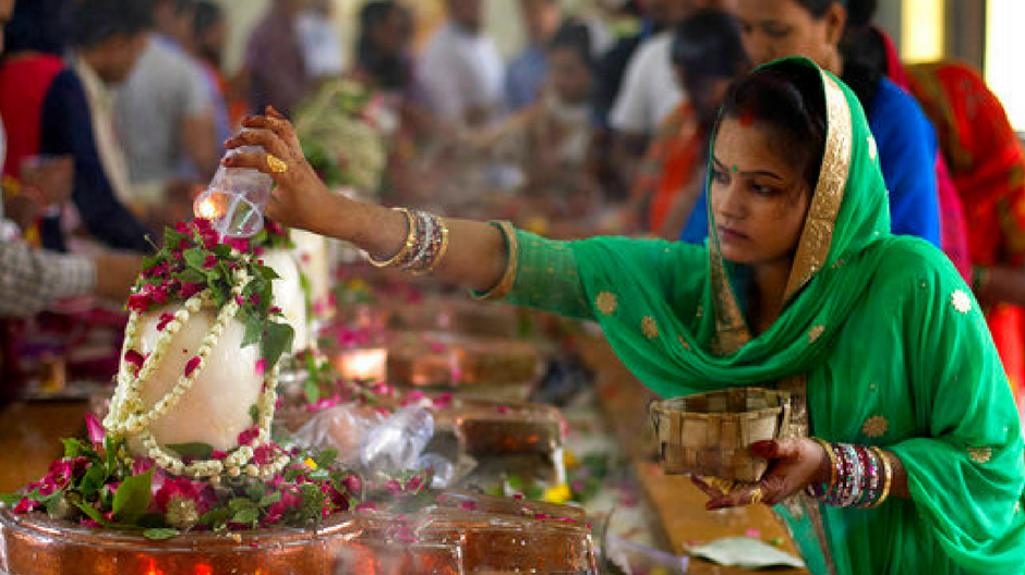 Woman worshiping Lord Shiva