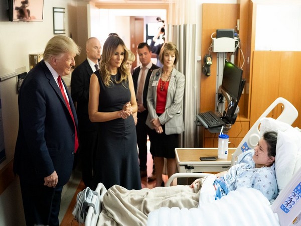 US President Donald Trump and First Lady Melania Trump meets a shooting victim at a hospital in Dayton