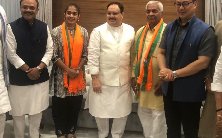 Wrestler Babita Phogat and her father Mahavir Singh Phogat meet BJP Working President JP Nadda