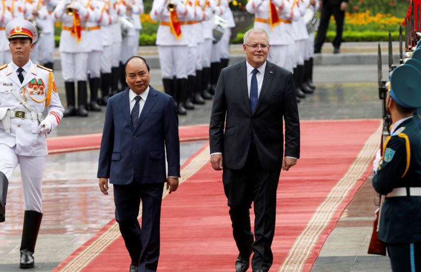 Australia's Prime Minister Scott Morrison reviews the guard of honour with his Vietnamese counterpart Nguyen Xuan Phuc