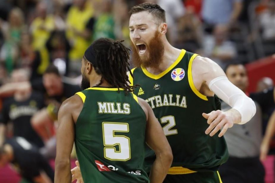 Australia's Patty Mills celebrates with Aron Baynes during the match