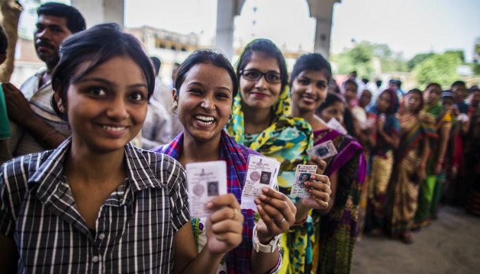 People standing in queue to cast vote