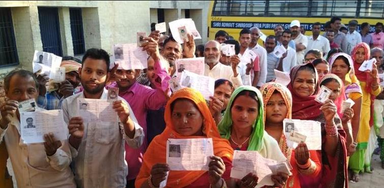 People standing in queue to cast vote