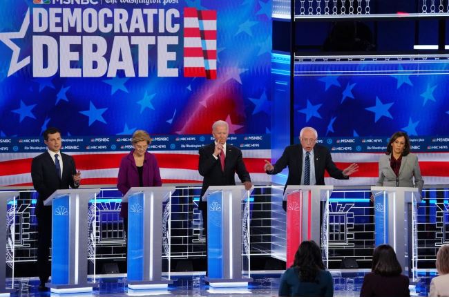 Democratic U.S. presidential candidates (L-R) South Bend Mayor Pete Buttigieg, Senator Elizabeth Warren, former Vice President Joe Biden and Senator Kamala Harris listen as Senator Bernie Sanders