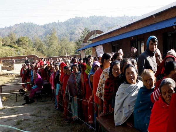 People standing in queue to cast vote