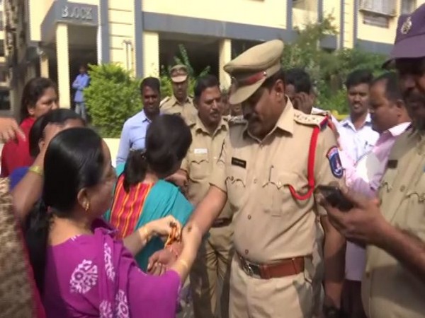 Women tied rakhis on police officer's hands in Telangana on Friday