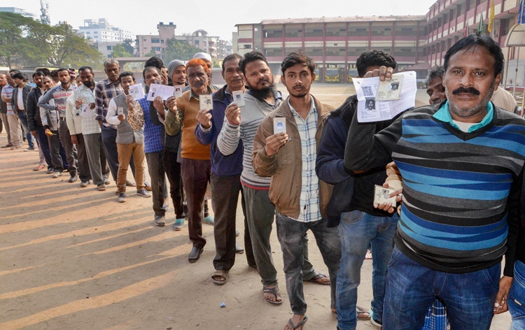 People standing in queue to cast their vote