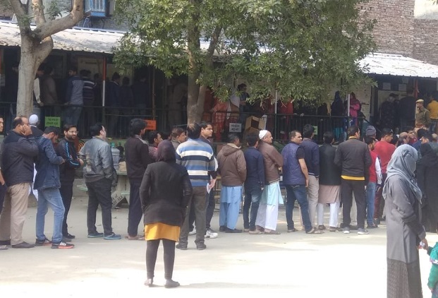 Voters line up outside polling booths