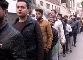 Voters line up outside polling booths