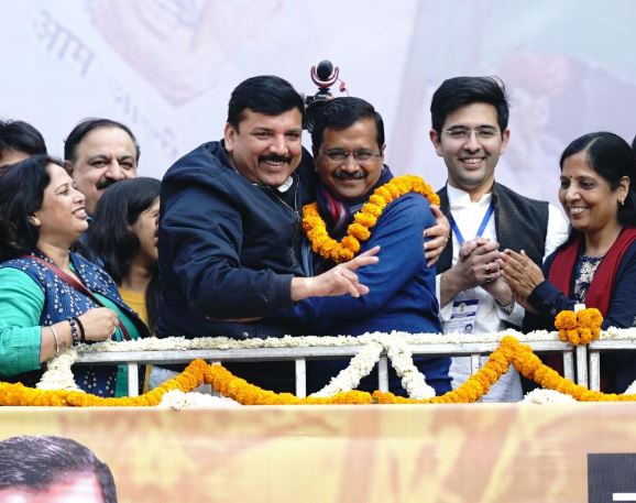 Arvind Kejriwal hugs Sanjay Singh on winning Delhi Assembly Elections