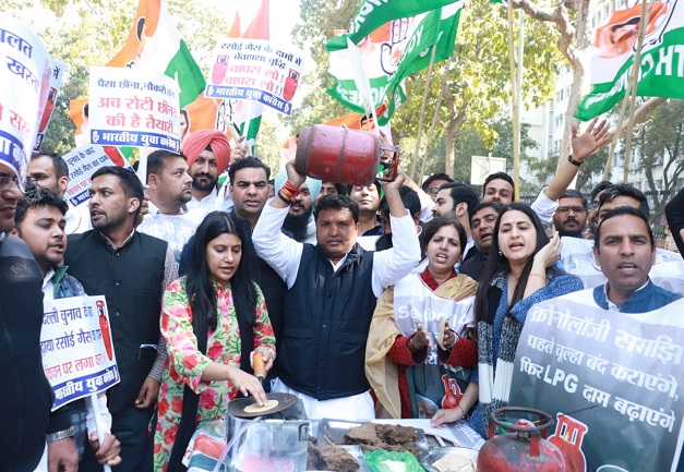 Members of the Indian Youth Congress protest against hiking price of LPG Cylinder