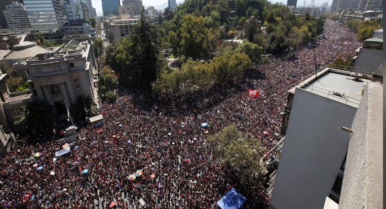 Women take part in a rally during the International Women's Day in Santiago