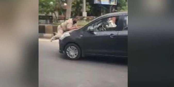 Cop on car bonnet