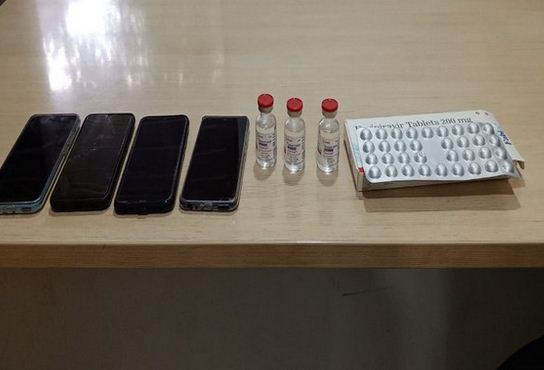 Seized COVID-19 antiviral drugs and mobiles