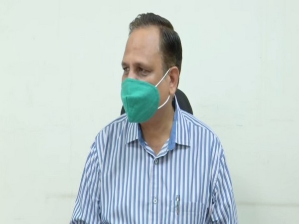 Delhi Health Minister Satyendar Jain speaking to reporters on Tuesday.