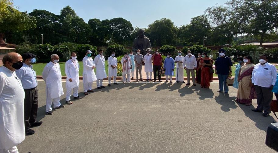 Opposition MPs stage protest before Gandhi statue in Parliament premises on Tuesday