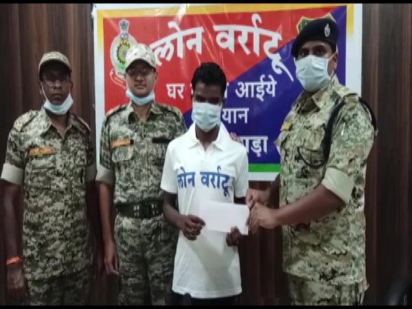 Kosa Markam surrenders before police under the 'Lone Varatu' (return to home) programme in Chhattisgarh's Dantewada on Monday