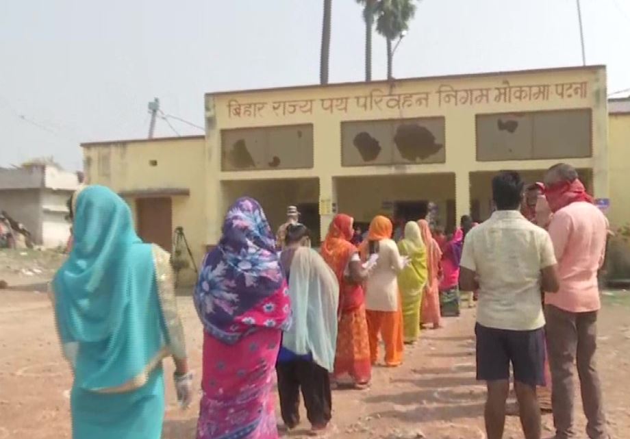 People standing line to caste their vote