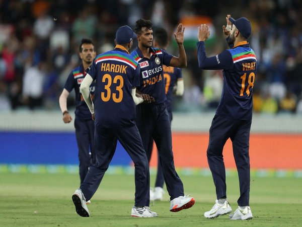 Indian players celebrating after taking a wicket