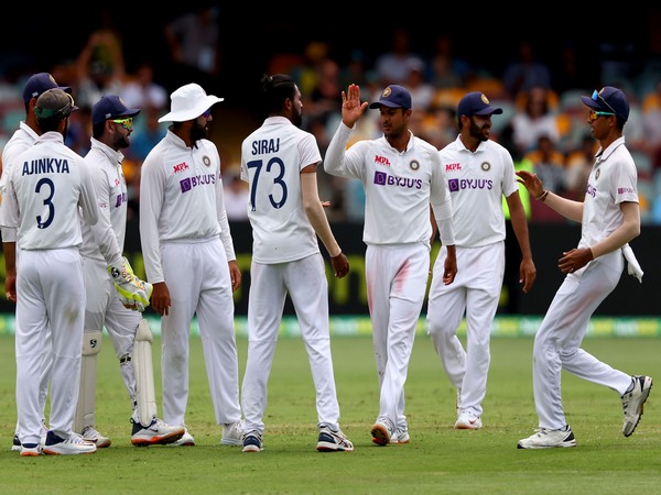 Indian players celebrate the fall of an Australia wicket