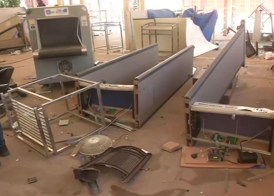 Visual of vandalised ticket counter, metal detector gate, broken shards of glass and Police caps seen at the premises of Red Fort