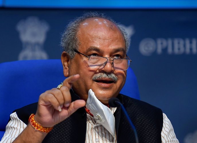 Union Minister Narendra Singh Tomar speaking to reporters