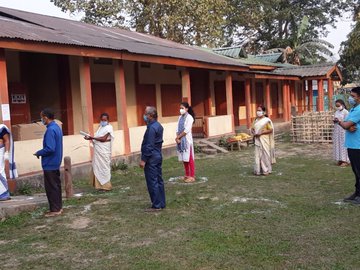 People Standing in queue to cast their vote