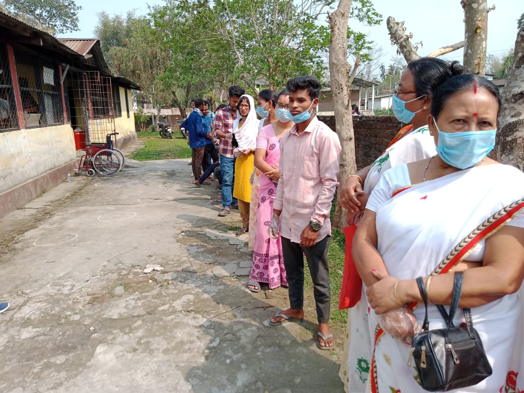 People Standing in queue to cast their vote