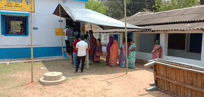 People Standing in queue to cast their vote