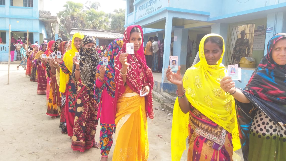 People Standing in queue to cast their vote