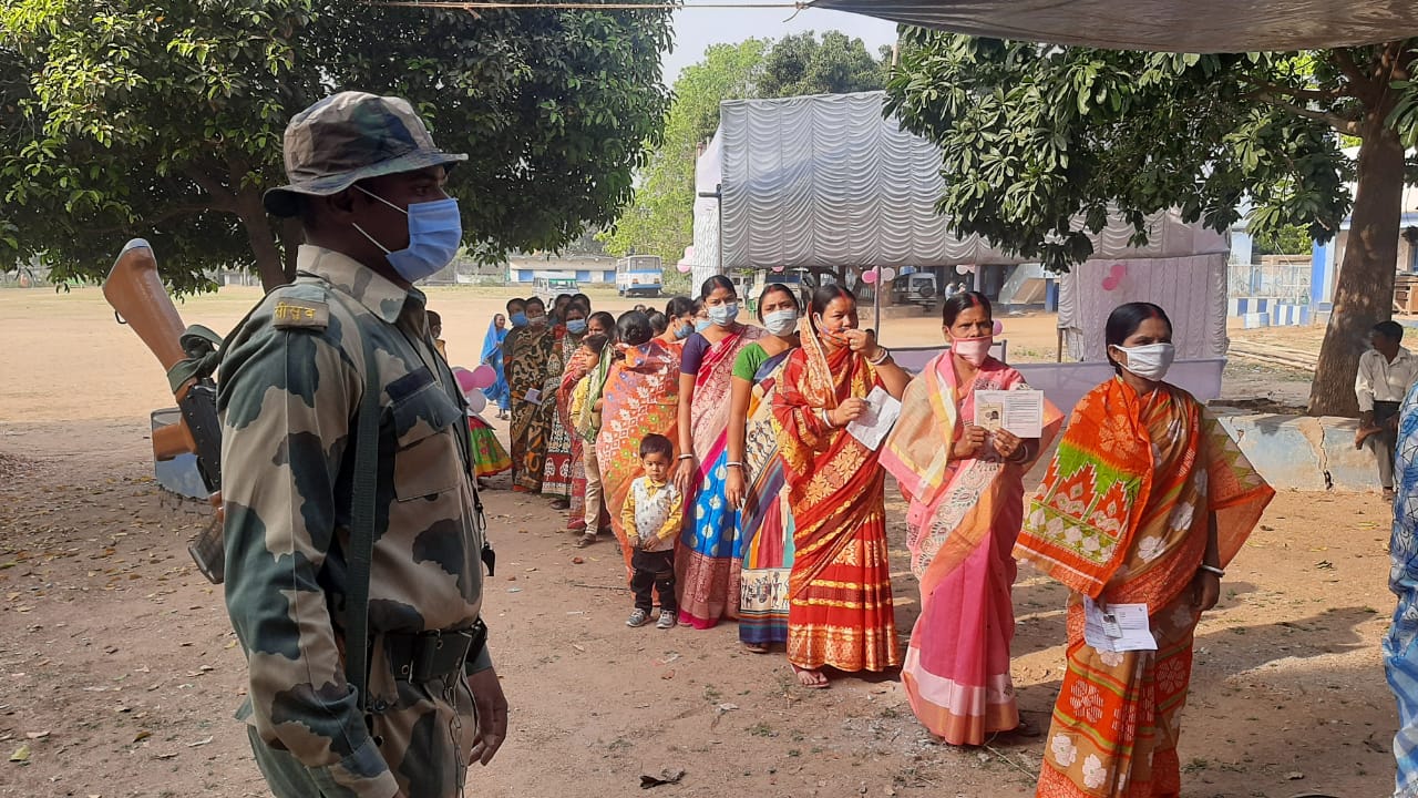 People Standing in queue to cast their vote