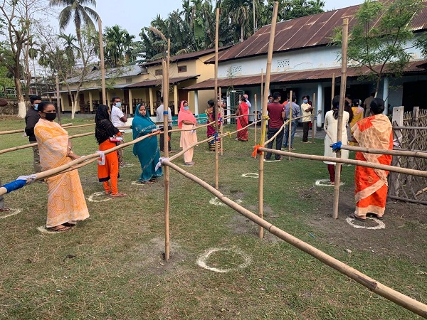 People Standing in queue to cast their vote