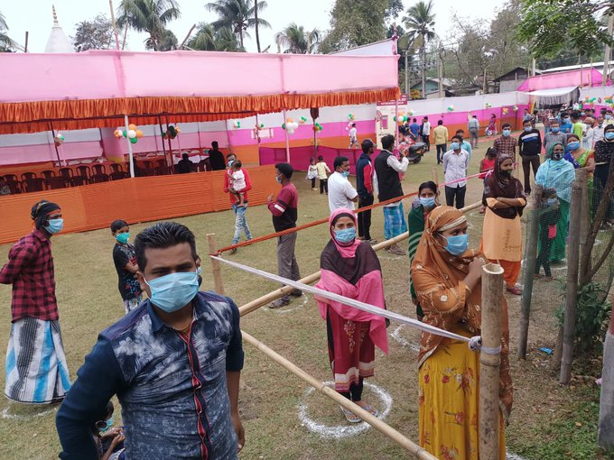 People Standing in queue to cast their vote