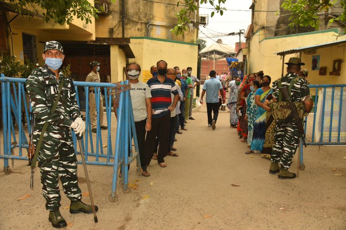 People Standing in queue to cast their vote