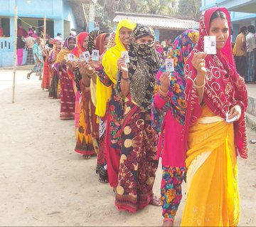 People Standing in queue to cast their vote