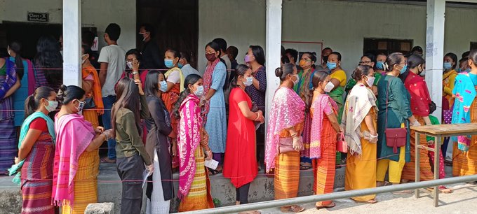 People Standing in queue to cast their vote