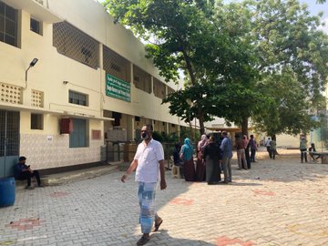 People Standing in queue to cast their vote