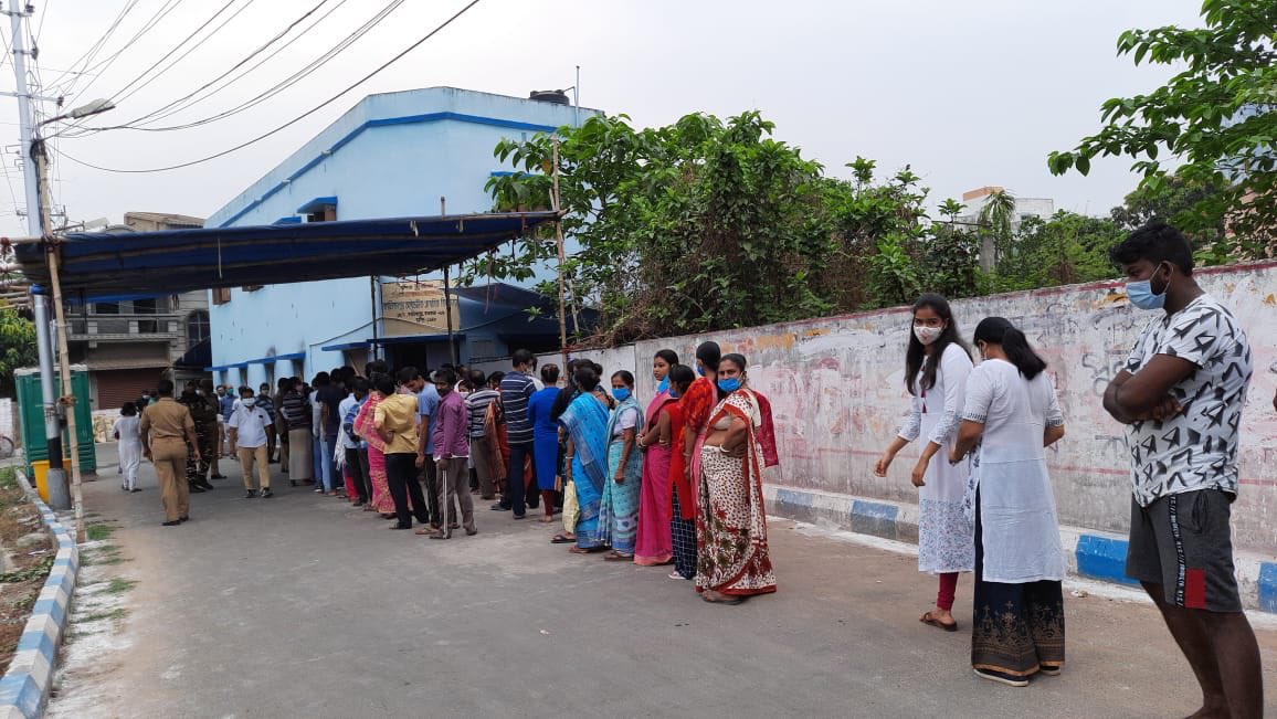 People Standing in queue to cast their vote