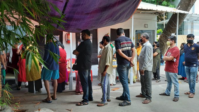 People Standing in queue to cast their vote