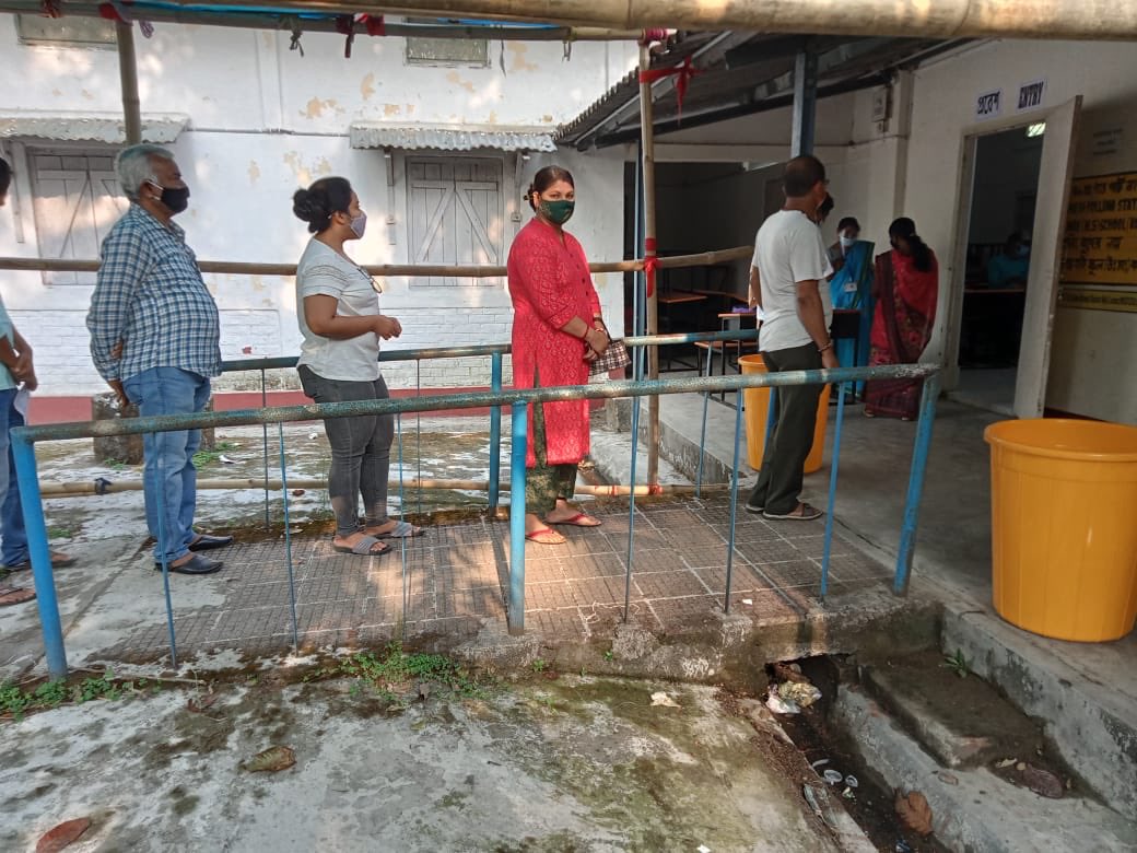 People Standing in queue to cast their vote