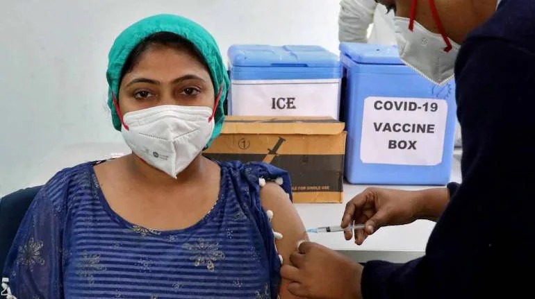 A woman getting vaccinated