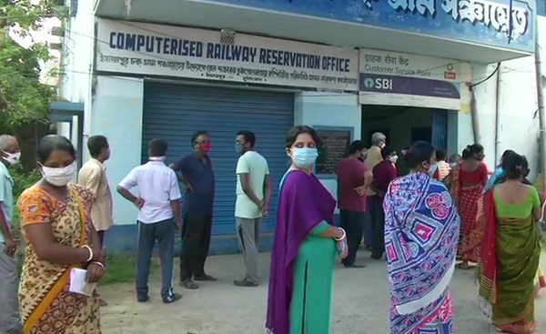 People Standing to Cast Votes