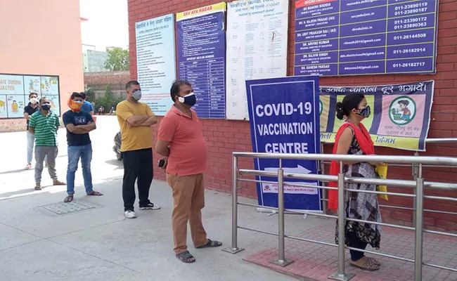 People standing in line for vaccination