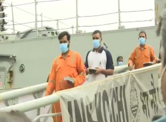 Rescued crew walks out of INS Kochi in Mumbai